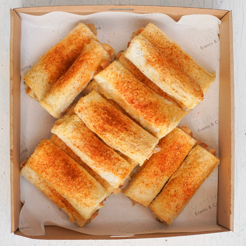 Box of grilled cheese sandwiches on a white background